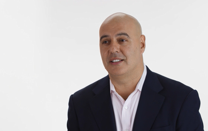 A man is talking in a video